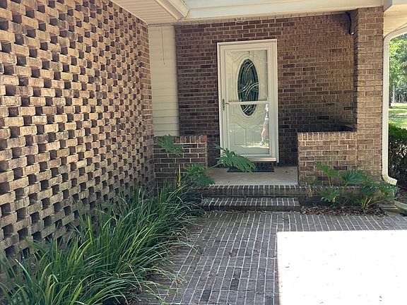 All brick home with covered porch.