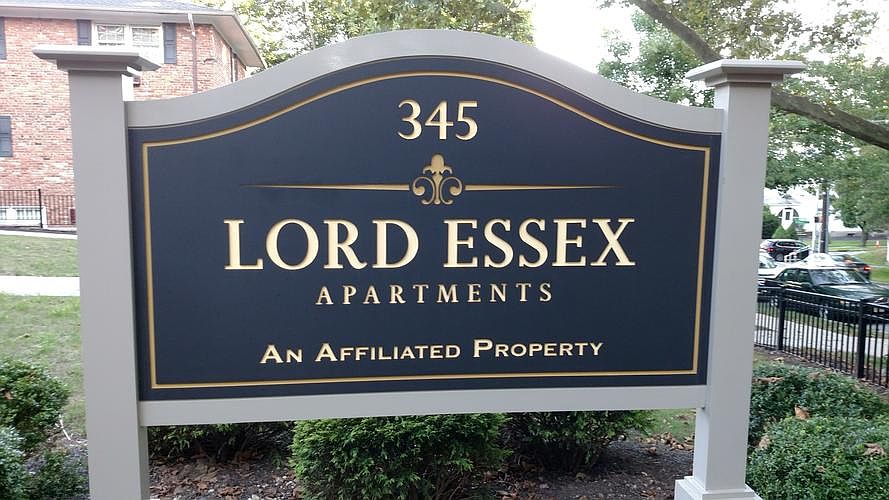 Sign in front of building 1, next to the driveway