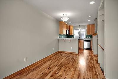 Spacious living area with stunning re-finished hardwood floors!