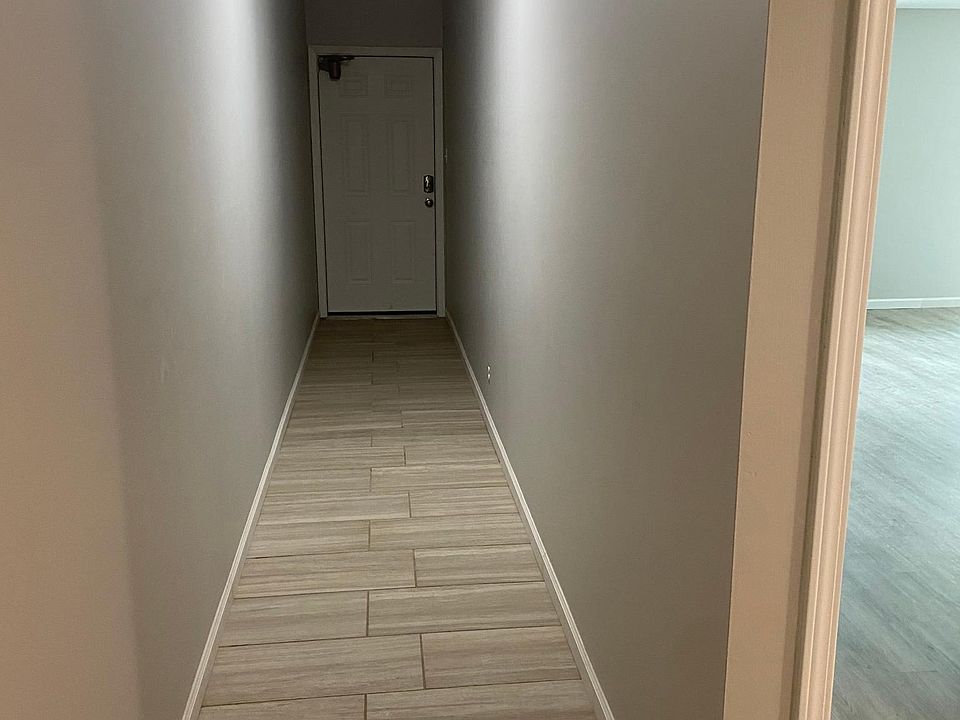 Foyer hallway with access to front and back of building