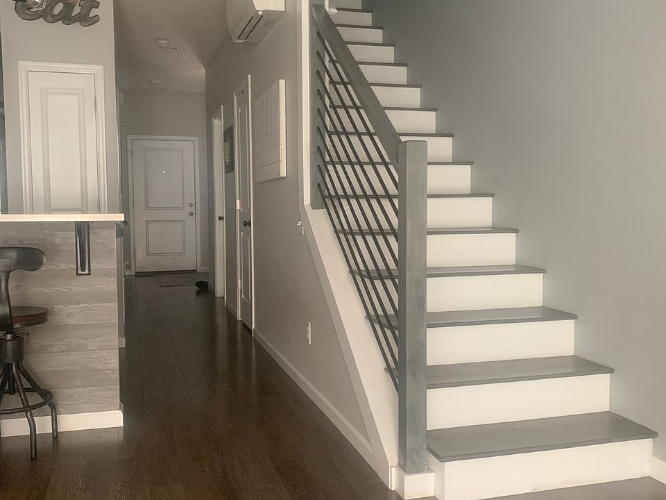 Open floor plan, updated wood laminate staircase and railing
