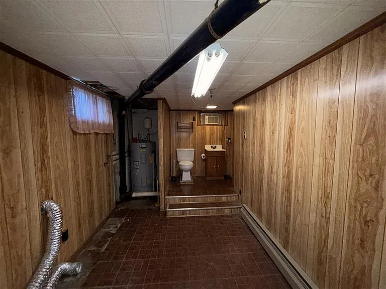 basement bathroom, water heater, and laundry room