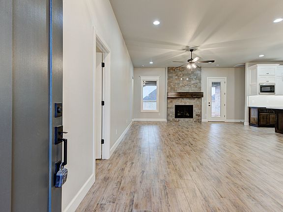 Entry into open concept living, dining and kitchen.