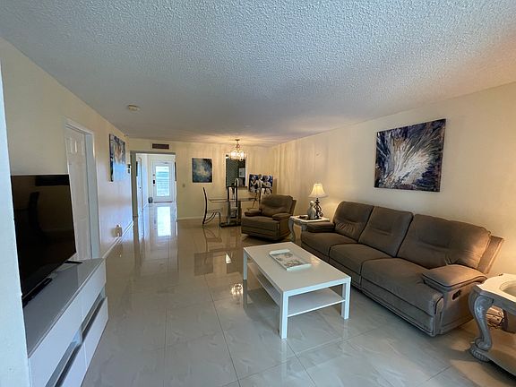 Living room, Dining room. View of front entrance.