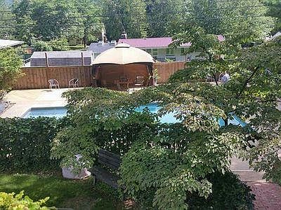 Backyard from deck with dogwood tree
