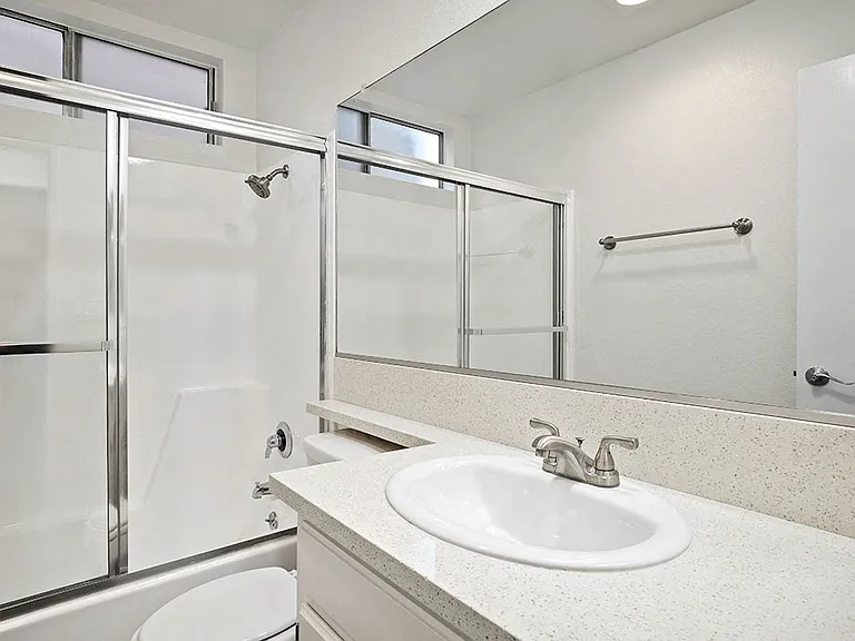 Modern styled bathroom with shower and tub.