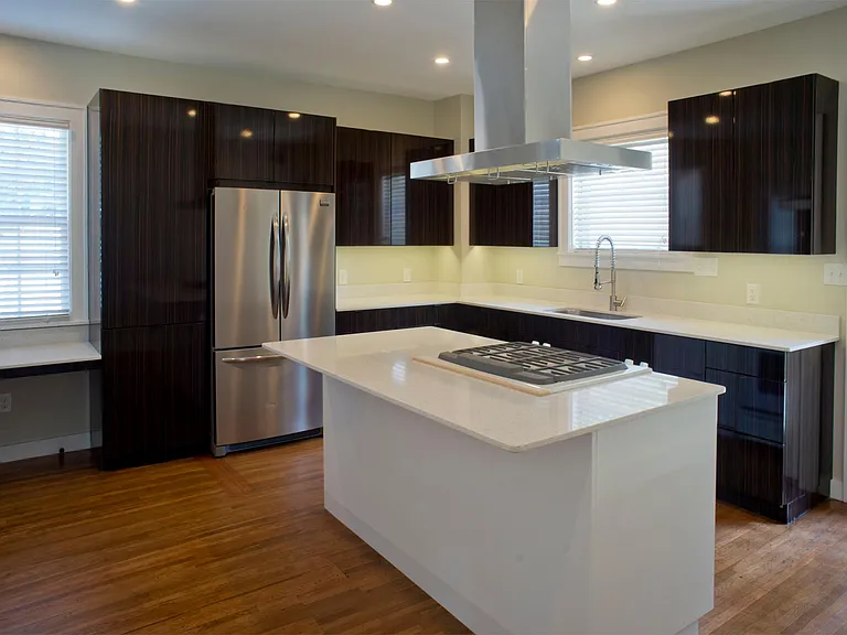 Gloss Ebony cabinets with amazing storage including European