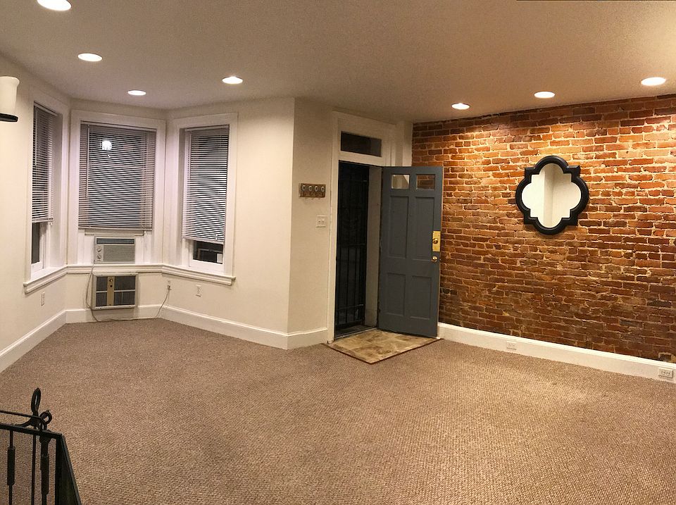 Living Room highlighting exposed brick wall