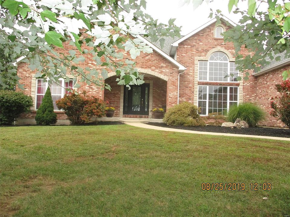 See your new home!  Beautiful entrance including the landscaped yard and lovely windows.