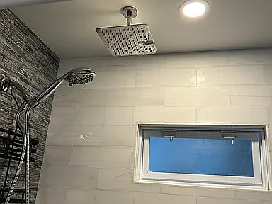 Rain shower, marble back tile, sides are glass tile, Queen bathrooms 2