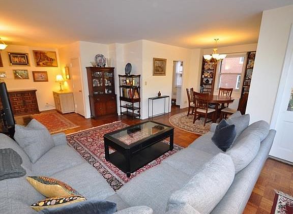 The large living room has a door that leads to a private balcony, great for enjoying the outdoors and opens to a "L" shaped dining room.  The is also a large foyer area great for a home office set up.  The living room is 20'-0" x 12'-0" and the dining roo