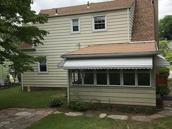 REAR OF HOUSE AND 3 SEASON ROOM