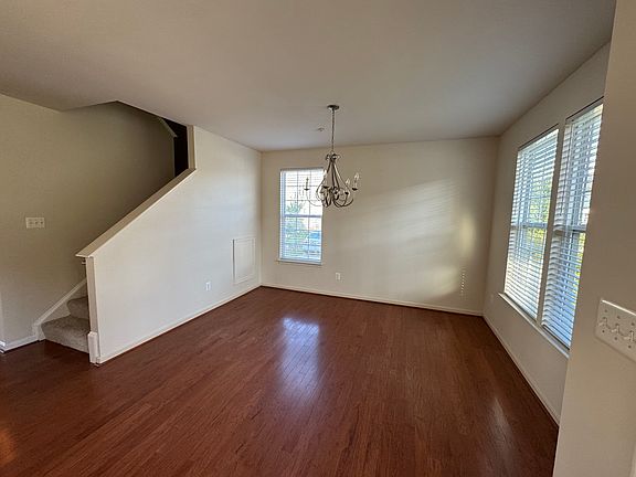 Here's a view of the dining room just off the front door. Note the white blinds that are throughout the house.