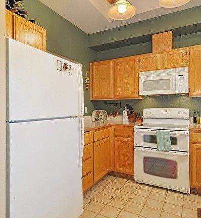 A view of the coffered ceiling and tile floor in the spacious kitchen.