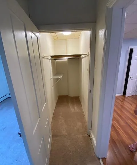 Walk in closet between kitchen and den.