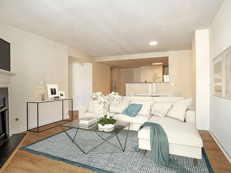 Renovated Package I kitchen, living, and dining areas with hard surface flooring