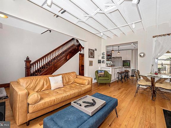 Living Room offers wood floors & track lighting