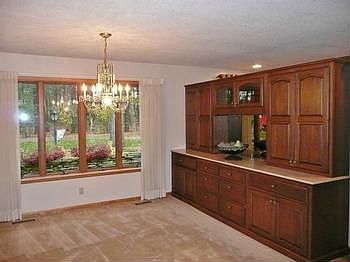 Built-in cabinets and buffet area of this wonderful formal dining rooms, also open to the family roo