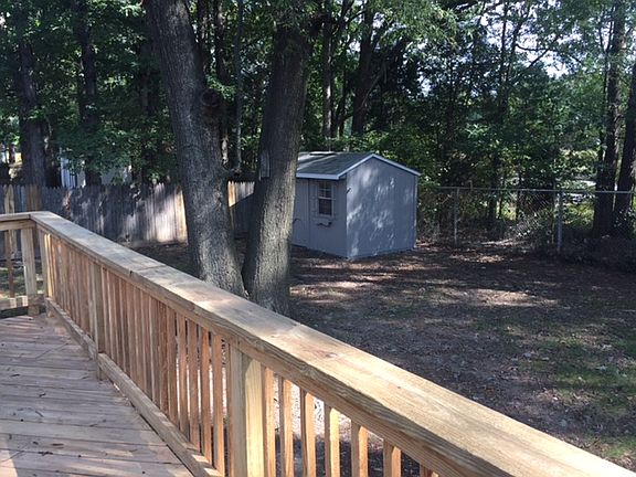 fenced yard with shed 10x20