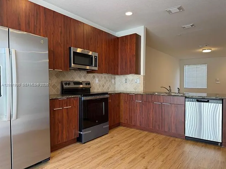 14958 SW 41st Ln #Townhouse 14958 — Photo 1