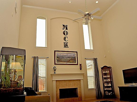 Feel the Volume in the Sunlit Great Room; Fireplace and Tile Floors