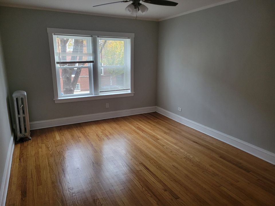 Large Living room with refinished hardwood floors and new windows