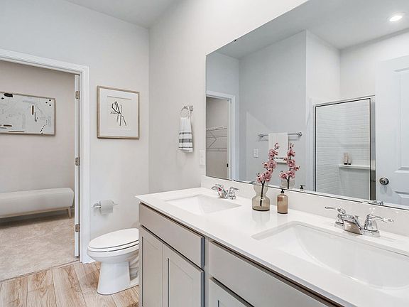 Owner s Bathroom with dual-sink vanity and walk-in shower. - Model Representation