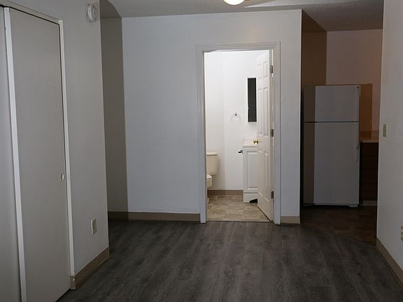 Living room looking toward bathroom and kitchen.