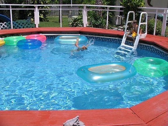 above ground swimming pool with deck and bbque and smoker