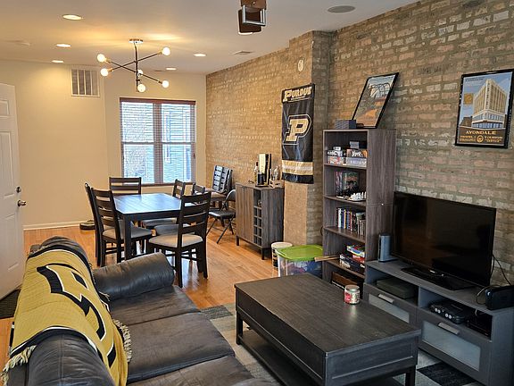 Large Living Room Dining Room Combo, with exposed brick