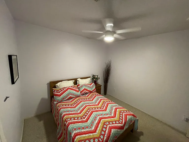 Third bedroom which can fit a queen bed 
Warm wall colors accent this room