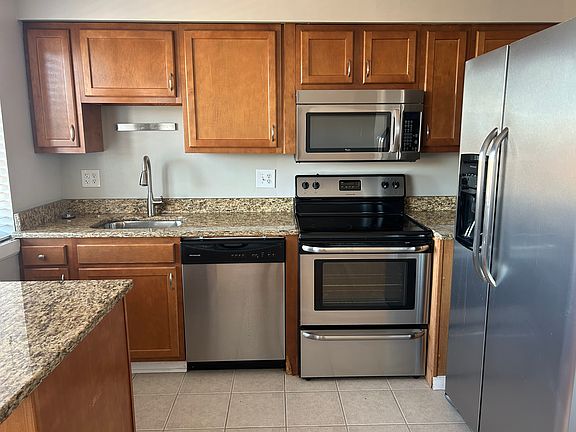 Stainless Appliances 
Including dishwasher, garbage disposal, smooth top range, vented microwave, refrigerator.