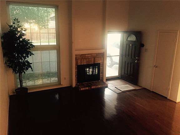 Look at those wood floors! They are real NOT laminate. Front door is newer.