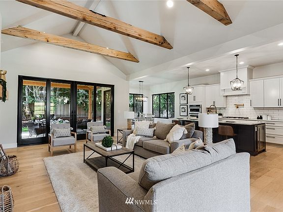 The gorgeous living room lounge sits at the center of this stunning residence.