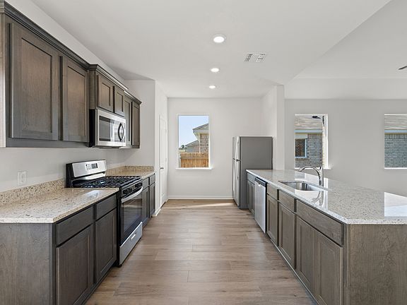 The kitchen of the Cassidy has sprawling granite countertops.