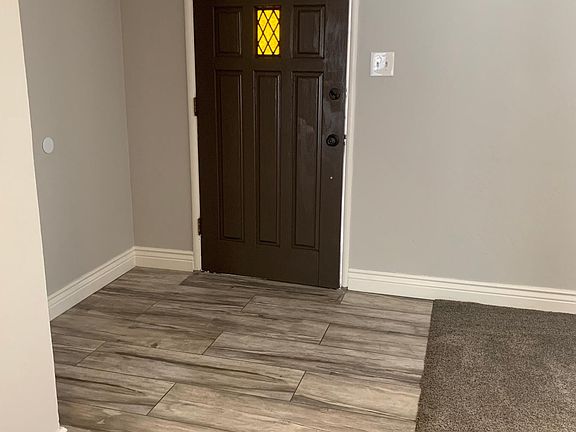Main entrance to home with beautiful tile entry.