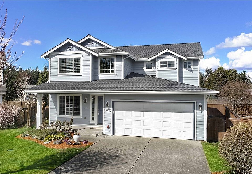 Beautiful front view of home with new roof and paint.
