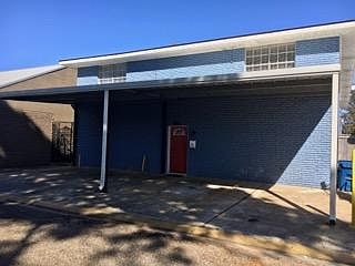 Front Entrance and Covered Parking