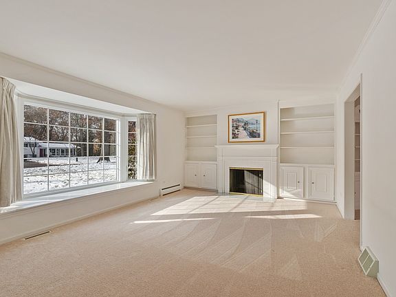 Versatile front room can be the place you kick back with the big screen and the fire