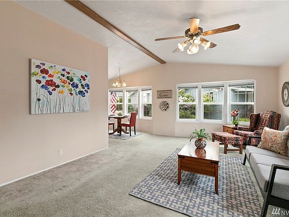 Enter into the spacious Light and bright living room. The walls are sheet rocked throughout and the ceilings are Vaulted. This room wraps into the dinning room.