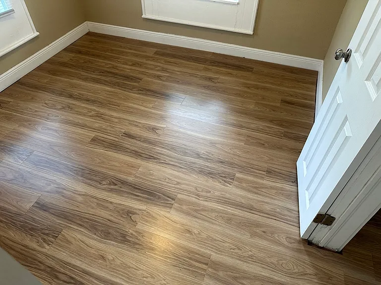 Third bedroom with new plank flooring and new cordless blinds, ceiling fan.