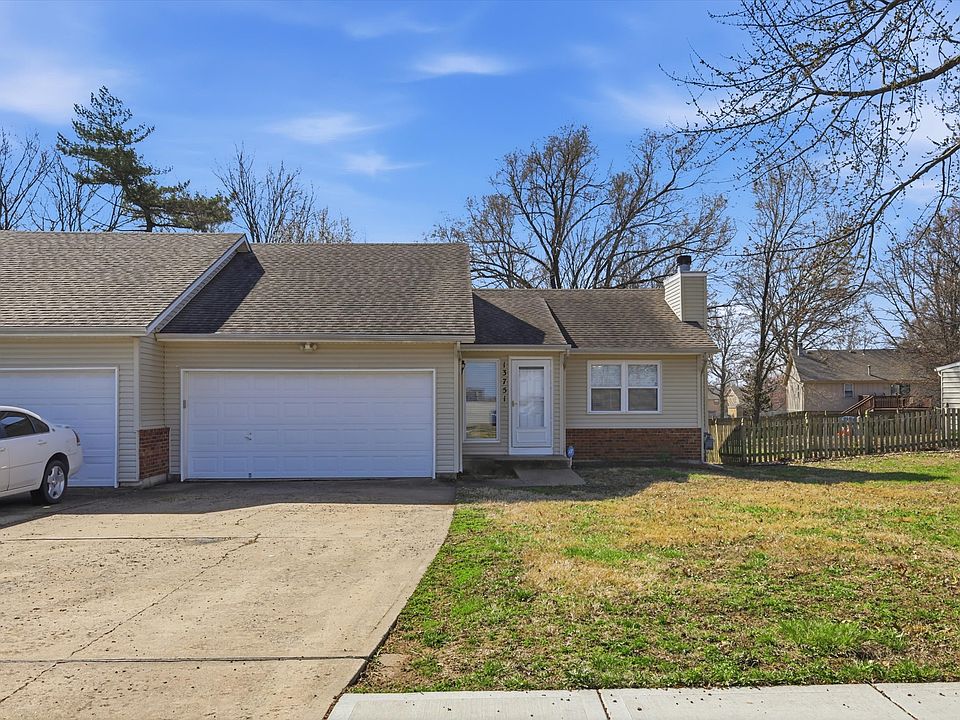 west side of the townhouse with 2 car garage