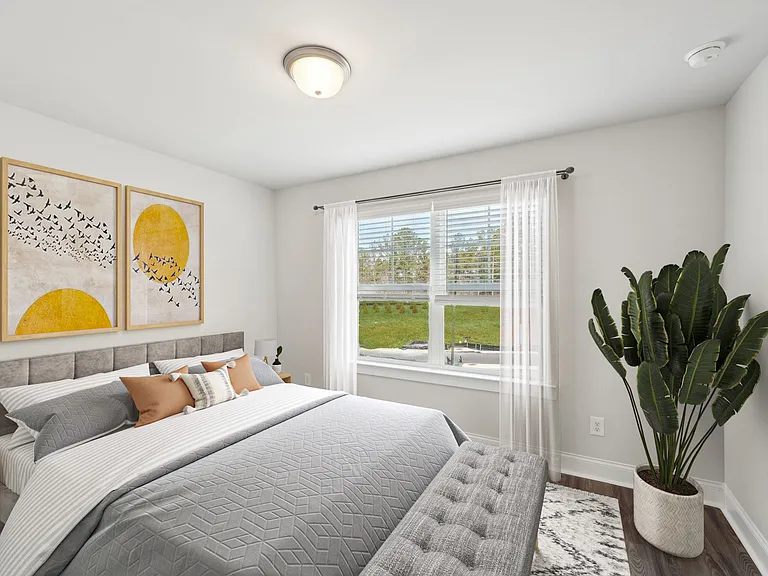 Another suite with a queen size bed and large window letting in a ton of natural light.