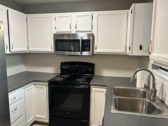 Kitchen with Microwave, Electric Range, Oven, Dishwasher