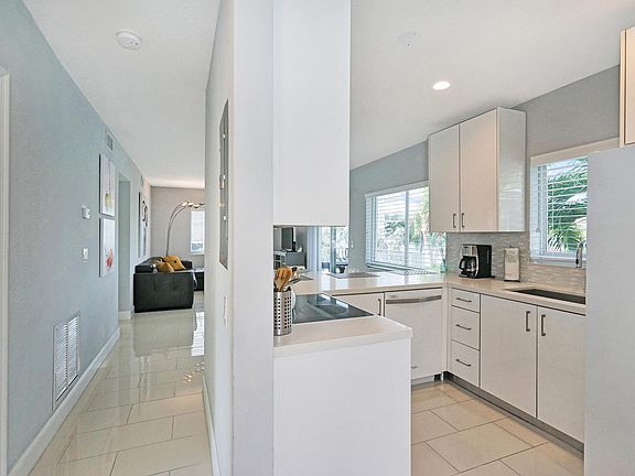 As you enter this home, you are greeted with a modern light and bright look.