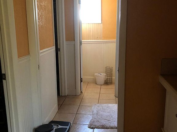 This is the view from the master bedroom, looking down the master bath... there is a single vanity, TWO walk-in closets (left), a tub/shower (right), and a private toilet.