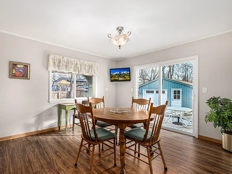 Expandable dining table seats 4-8 guests.