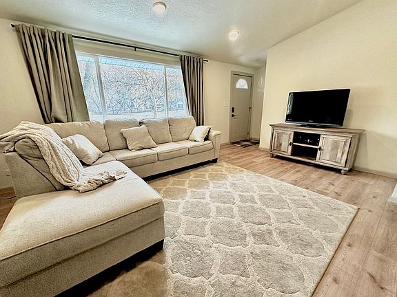 Wide open main floor living space.

Front entrance pictured.