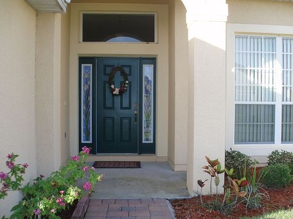 Gracious entrance with stained glass sidelights