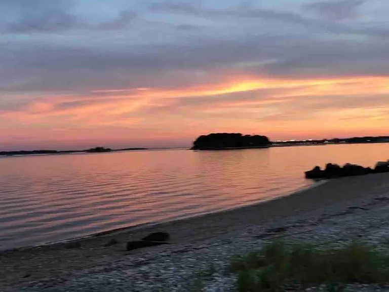 Sunsets over the water are simply spectacular from our beach deck
